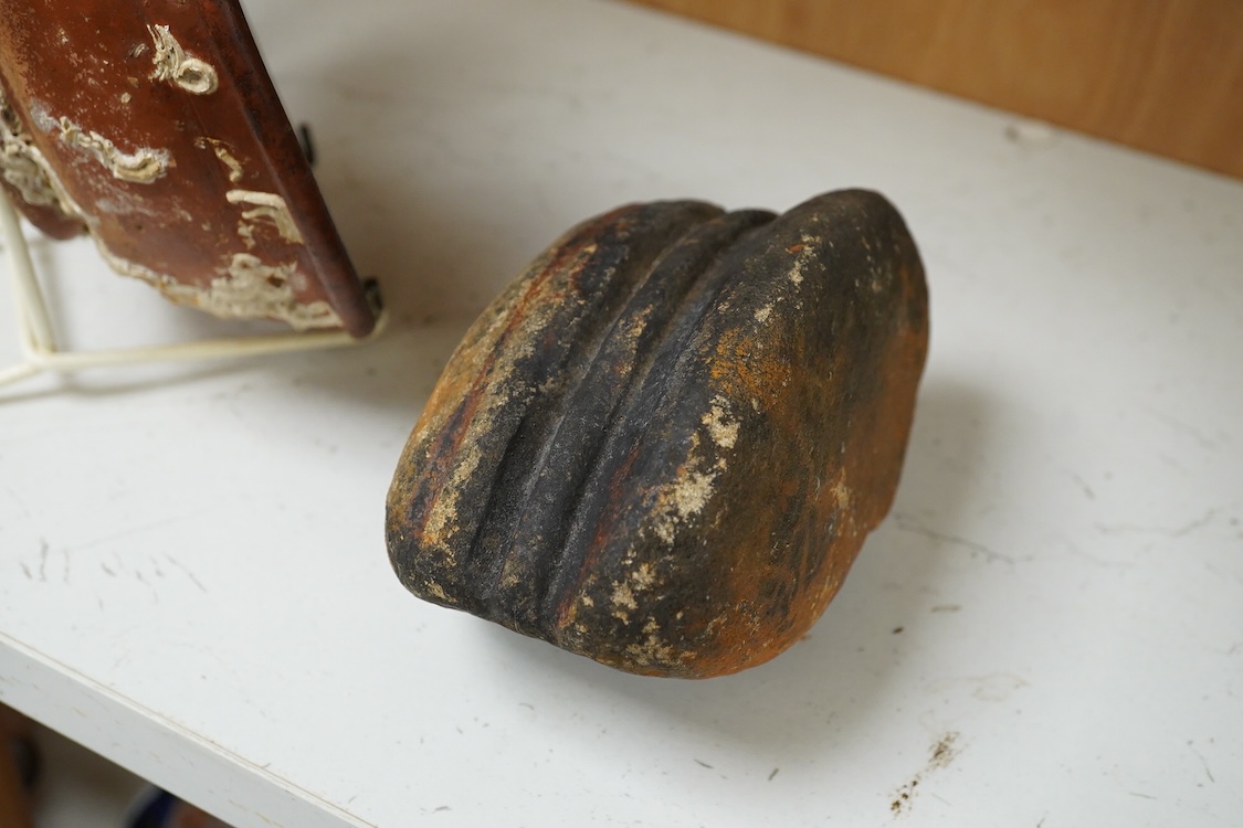 A Roman Samian ware bowl with provenance, allegedly from the Pan Rock shipwreck, together with an Iron Age Quern stone, largest 19cm in diameter